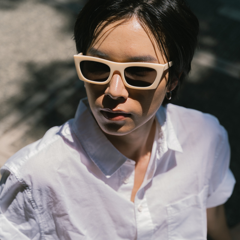 Man in White Outfit and Sunglasses Outdoors