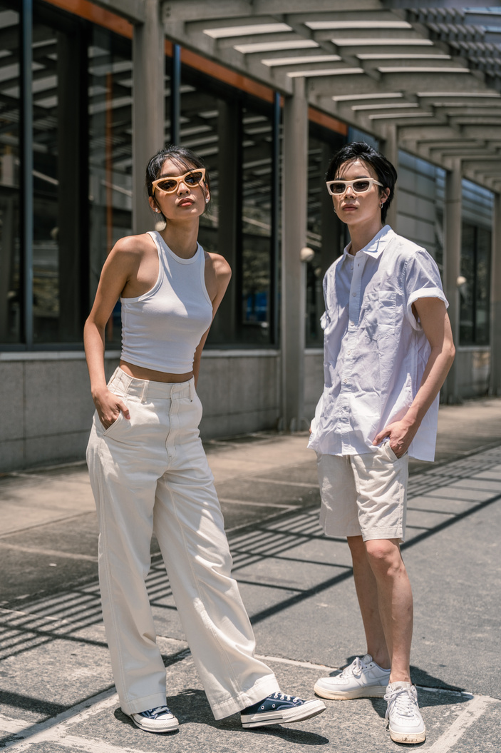 Man and Woman in White Outfit and Sunglasses Outdoors